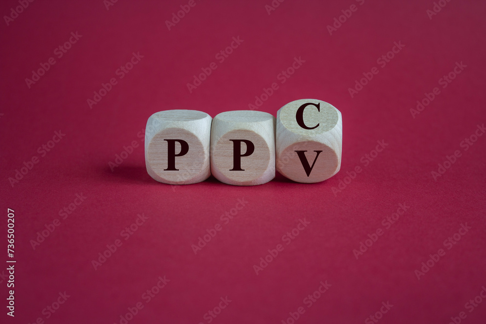 Turned wooden cube and change the expressions PPV (pay per view) and PPC (pay per click). Beautiful red background. Turned wooden cube and change the expressions PPV (pay per view) and PPC (pay per click). Beautiful red background.