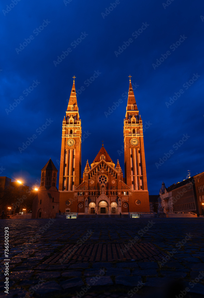Cathedral of Szeged is famous landmark in Hungary outdoor at blue hour.
