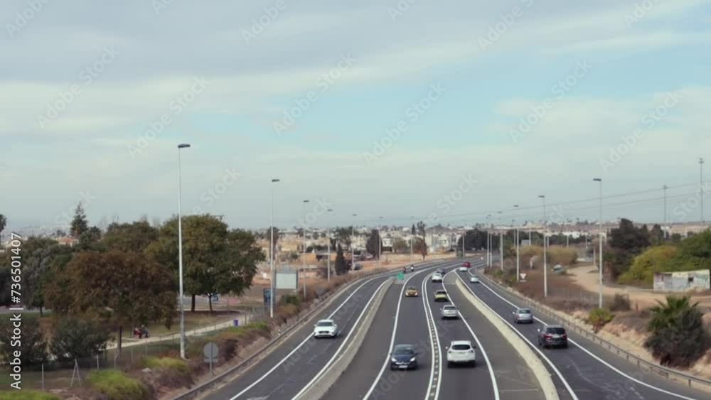 car traffic on the highway in a European city. Top view of cars rushing along the sidewalk. car traffic on the highway in a European city. Top view of cars rushing along the sidewalk.