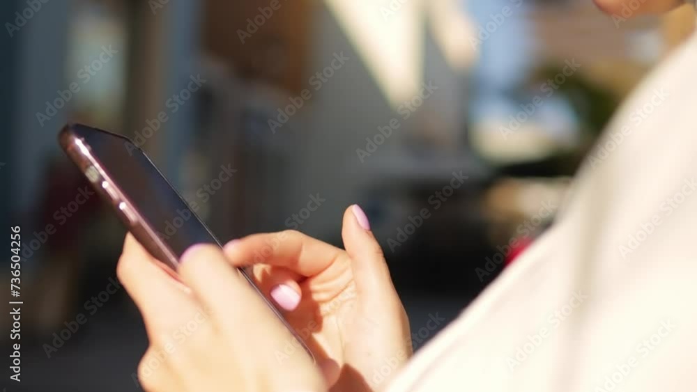 Cheerful woman browsing the Internet or chatting on social networks close-up Cheerful woman browsing the Internet or chatting on social networks close-up