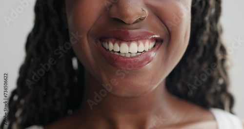Woman, mouth and lick teeth for dental, health and wellness with cleaning for plaque on white background. Oral hygiene, face zoom and orthodontics, tongue out with veneers and happy for grooming photo