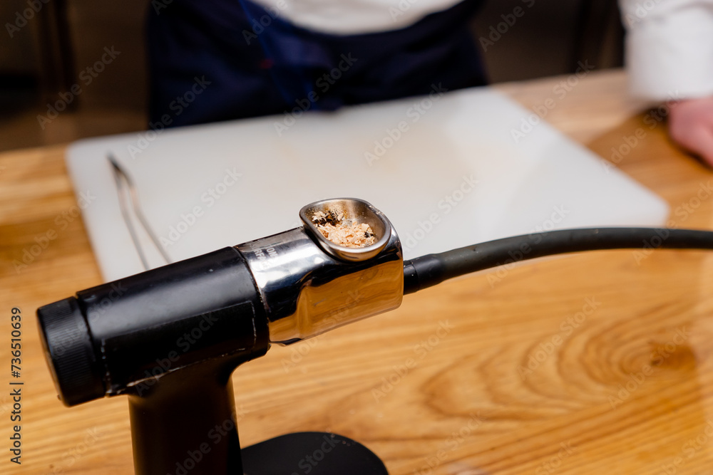 close-up of mechanism with a dry ingredient standing on the table professional kitchen utensils