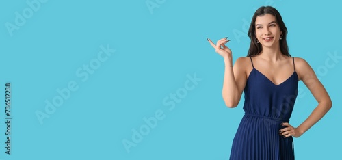 Beautiful young woman in st...