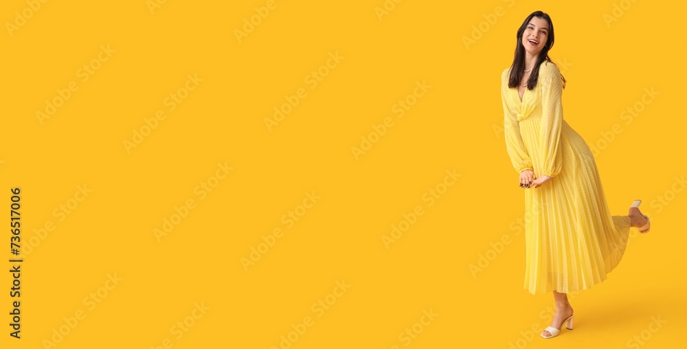 Beautiful young woman in stylish dress on yellow background with space for text Beautiful young woman in stylish dress on yellow background with space for text