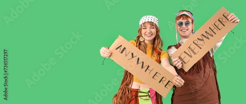 Couple of hippies holding c...