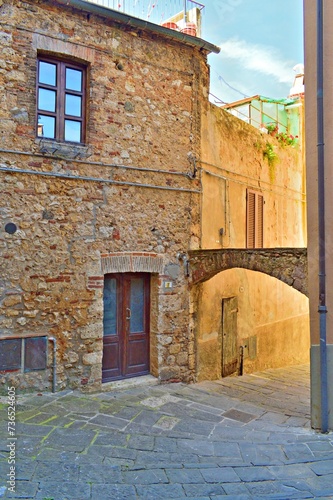Fototapeta Naklejka Na Ścianę i Meble -  characteristic alley in the medieval village of Massa Marittima in Grosseto, Tuscany, Italy