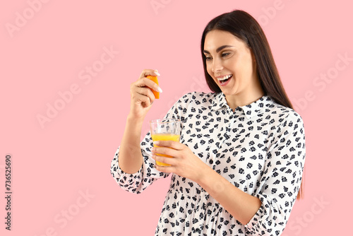 Young woman with glass of j...