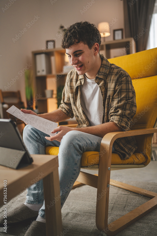 man use digital tablet show papers letter document video call at home