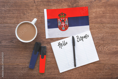 Schilderij op canvas serbian national flag, cup of coffee, notebook with the inscription hello in ser