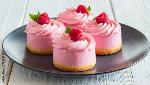 pink cakes on plate on white background