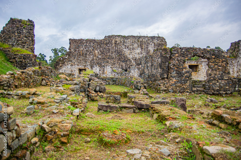 ruins and destroyed walls with the foundation of an old fortress and fortress wall, in an ancient ancient war
