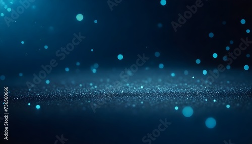 Blue glowing particles over a textured surface with a dark background © sanart design
