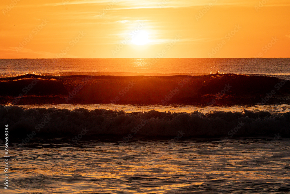 Avon By the Sea, New Jersey, USA - Sunrise over Atlantic Ocean waves 