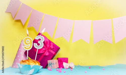 Date of birth with cake and number 93. Colorful card happy birthday for a girl. Copy space. Anniversary card pink. Congratulations on the decorations are beautiful.