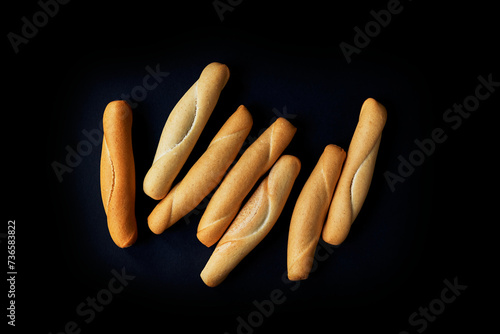 Spanish rolls-Picos Camperos on a black background. Isolated. Top view photo