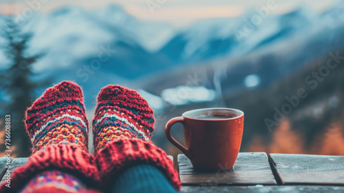 A cozy scene featuring a person's feet in socks, accompanied by a cup of coffee. Perfect for showcasing relaxation and comfort.