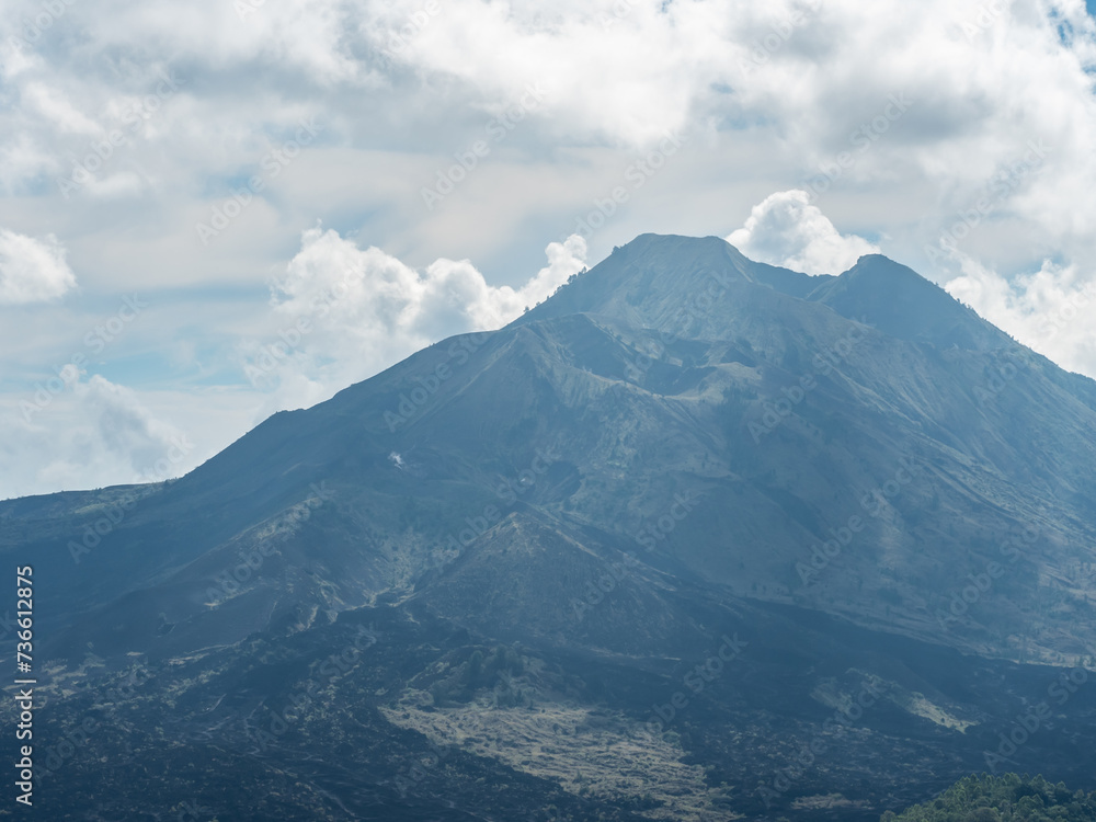 The view of volcanic terrain covered with black ash of Batur mountain, Indonesia.