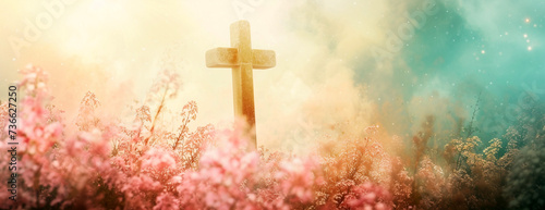 Christian cross with celestial glow effect among wild flowers