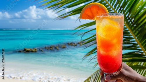 Man enjoying a lava flow cocktail on a tropical paradise beach with copy space for text placement