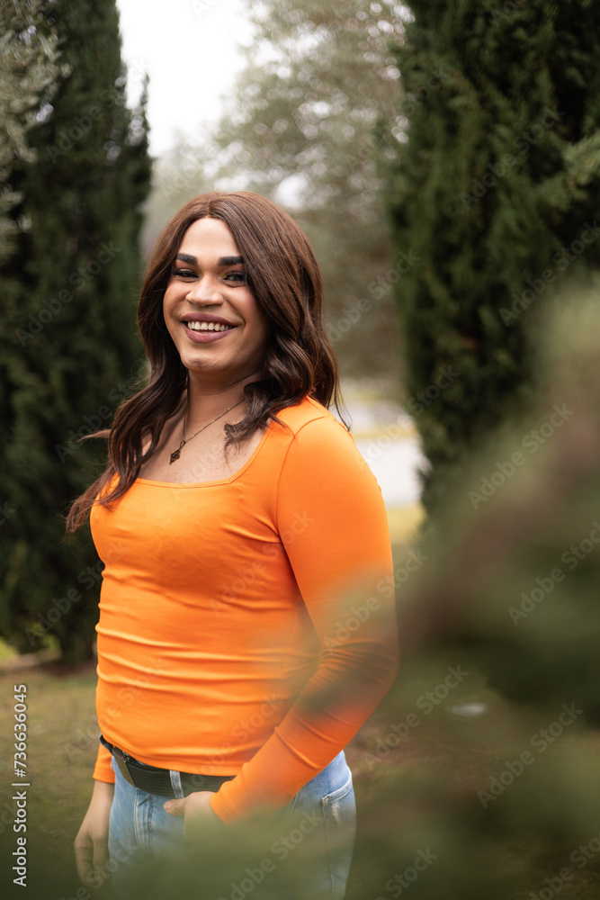 Vertical portrait of trans woman smiling cheerfully to the camera Vertical portrait of trans woman smiling cheerfully to the camera