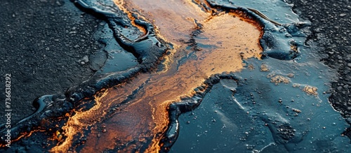 Oil spill on pavement as environmental pollution concept.