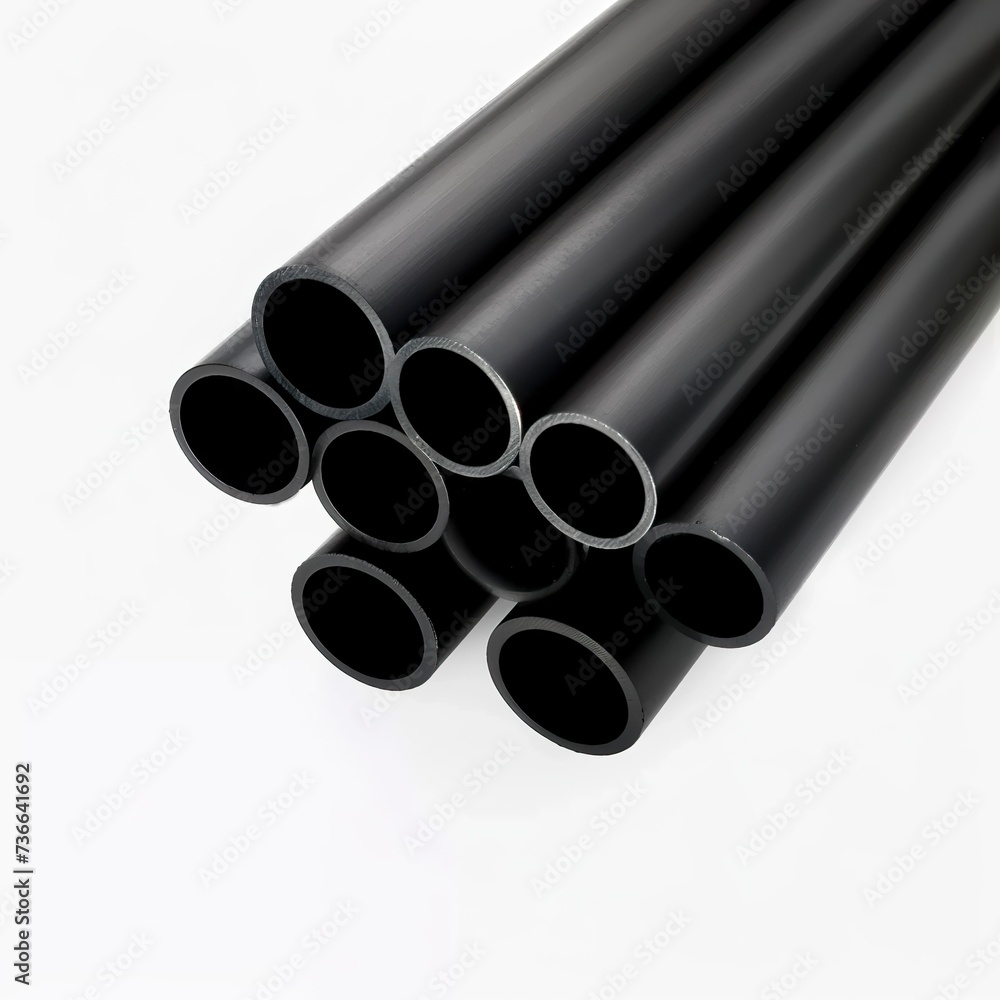 Fototapeta premium A set of robust black metal cylindrical tubes on a white background. Sophisticated and modern minimalist metallic tubes. Practical and functional metal tubes.