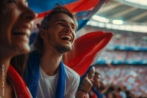 Slovakia fans cheering on their team from the stands of sports stadium.