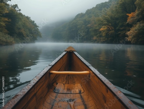 Tranquil canoe expedition across a dawn-misted lake, illustrating peace, the thrill of exploration, and engagement with the water