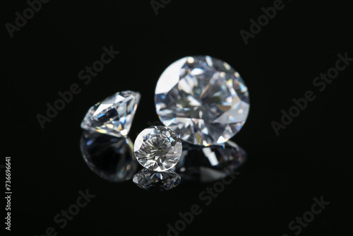 Beautiful shiny diamonds on black mirror surface