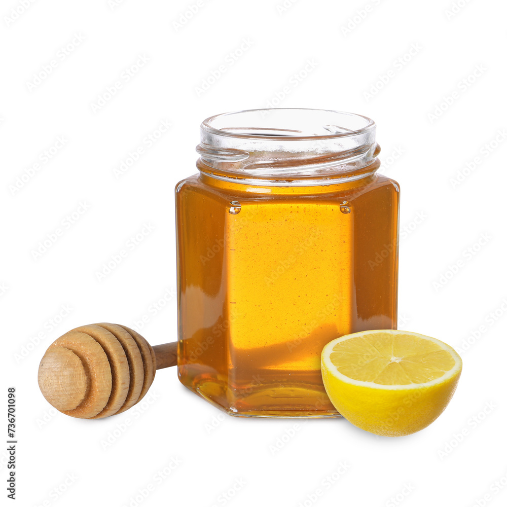 Honey in glass jar, dipper and lemon isolated on white Honey in glass jar, dipper and lemon isolated on white