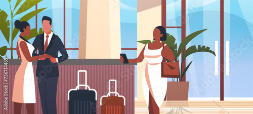 tourists with luggage departing from business trip standing at reception desk in hotel lobby recreation travel check-in concept