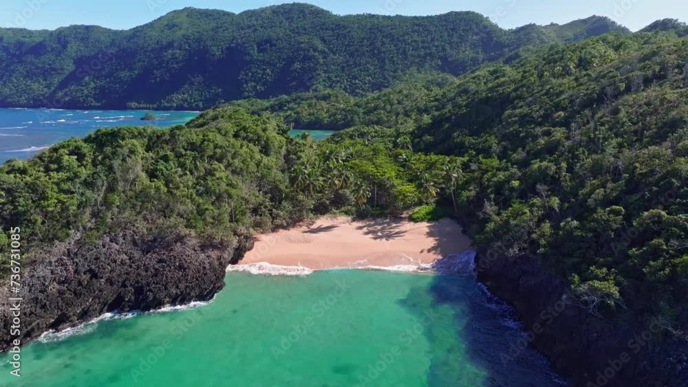 Secluded pristine tropical Caribbean beach in cove surrounded by jungle. Aerial Secluded pristine tropical Caribbean beach in cove surrounded by jungle. Aerial