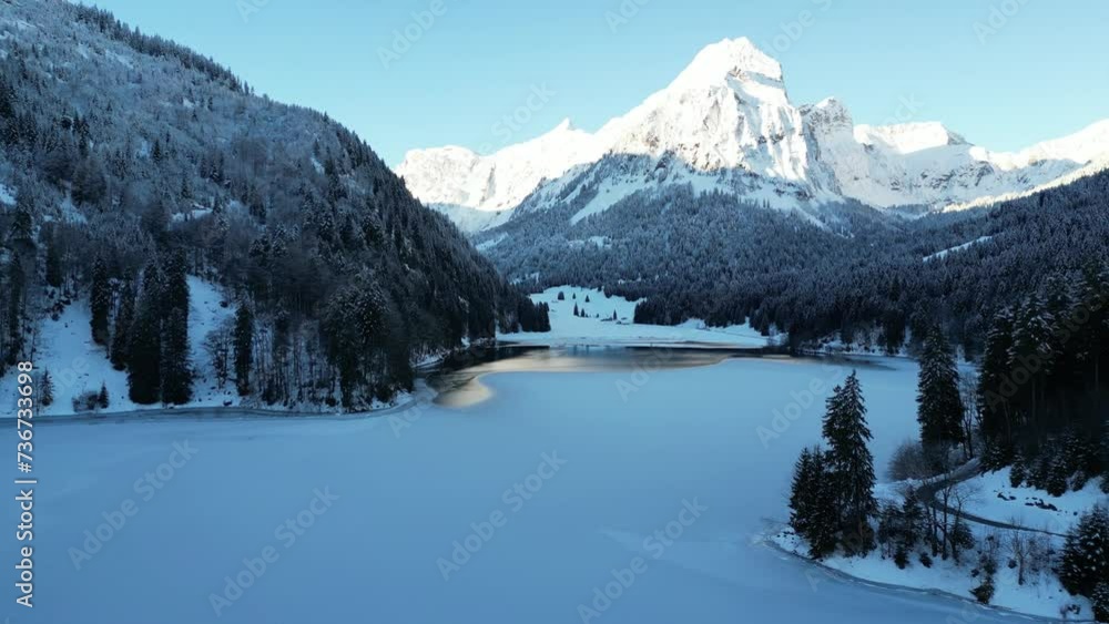 Obersee Glarus Switzerland low flight over lake at base of amazing Alps background Obersee Glarus Switzerland low flight over lake at base of amazing Alps background