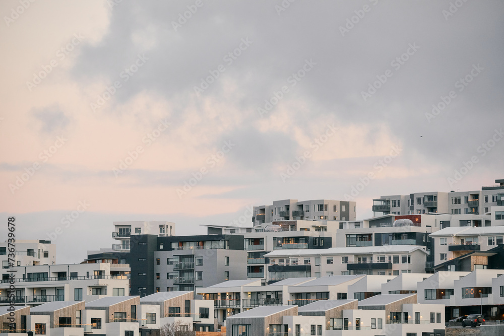 Cityscape with residential buildings under cloudy sky