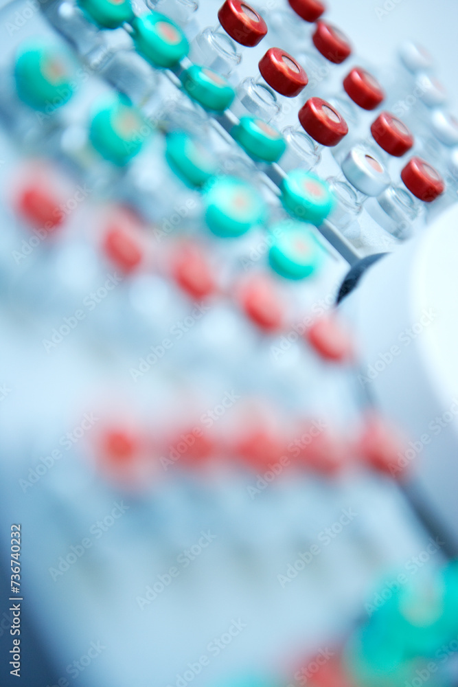 A close-up of vials with red and green caps A close-up of vials with red and green caps