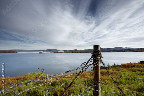 Barbwire fence and lake  Thingvallavatn  Iceland