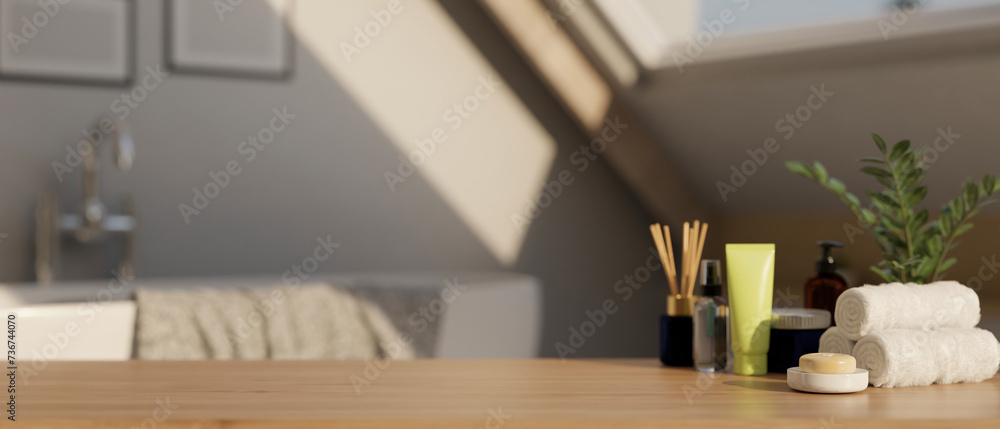 A display space on a hardwood table with bath accessories in a modern bright and clean bathroom. A display space on a hardwood table with bath accessories in a modern bright and clean bathroom.