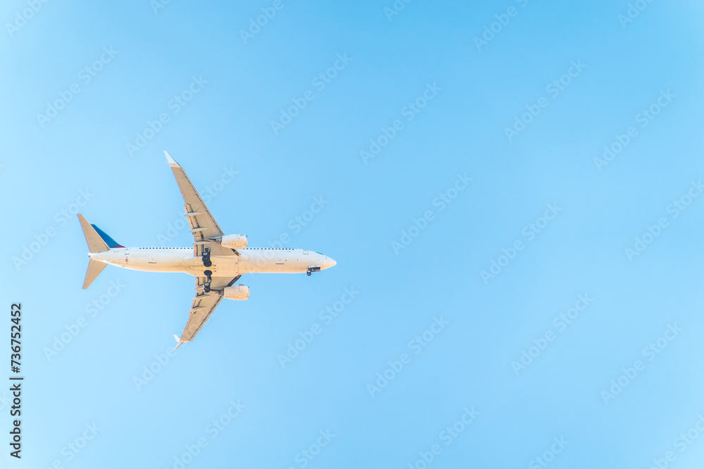 Airplane before landing in blue sky, Boeing 737-800 Airplane before landing in blue sky, Boeing 737-800
