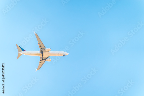 Airplane before landing in blue sky, Boeing 737-800