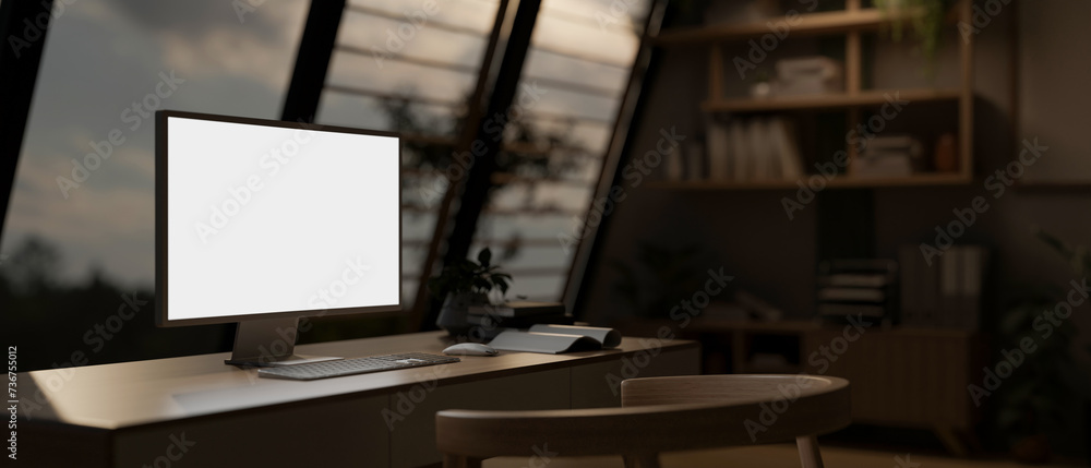 A modern home office or private office with a white-screen computer mockup on a table. A modern home office or private office with a white-screen computer mockup on a table.