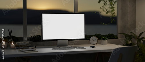 Wallpaper Mural A modern home office in the evening with a PC computer mockup on a table against the window. Torontodigital.ca