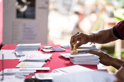 The process of the voting organizer group stamping each paper card for voters in the Indonesian election.