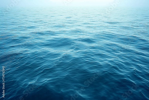 Expansive view of the open sea with gentle waves creating a pattern on the blue surface, symbolizing freedom and infinity