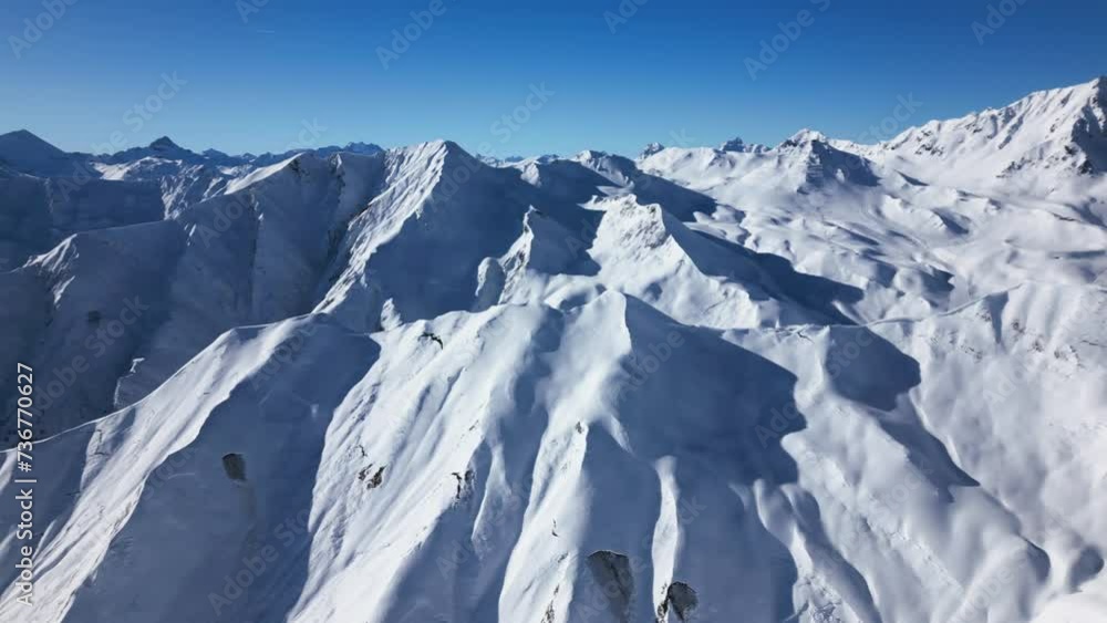 beautiful panoramic view over snow-covered mountains. pan over blue sky and wide horizon beautiful panoramic view over snow-covered mountains. pan over blue sky and wide horizon
