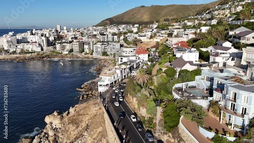 Cape Town, South Africa, aerial drone over a busy coastal road  with downtown in the background