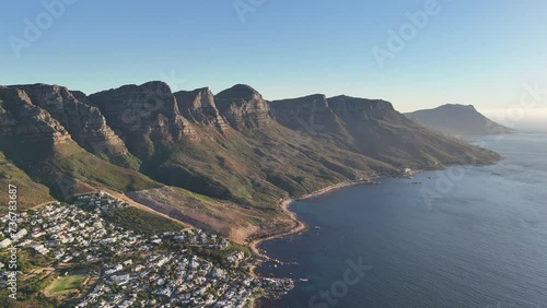 Sunset Aerial View of Twelve Apostles Mountains over Cape Town and Camps Bay, South Africa