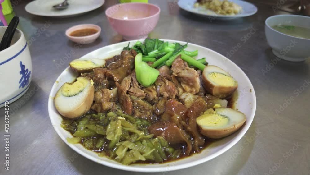 slow-braised pork leg, a beloved delicacy in Thailand's vibrant street food culture slow-braised pork leg, a beloved delicacy in Thailand's vibrant street food culture