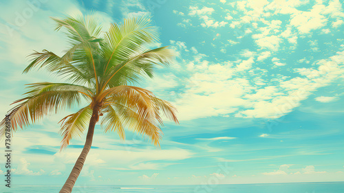 Serene tropical beach scene with a single palm tree against a clear blue sky and fluffy white clouds. 