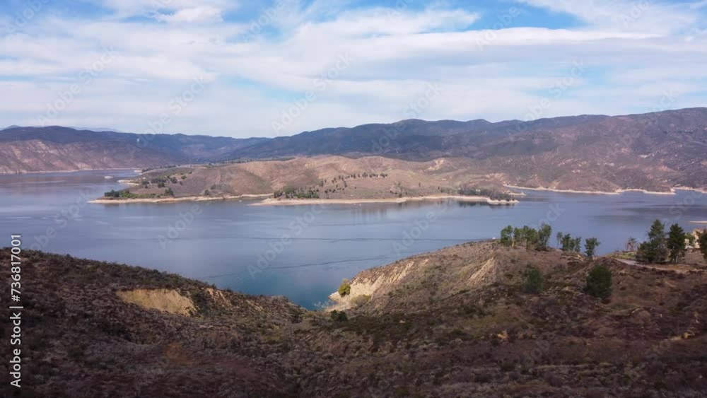 Drone shot of the reservoir surrounded by the mountains in Castaic, California outside of Los Angeles. Drone shot of the reservoir surrounded by the mountains in Castaic, California outside of Los Angeles.