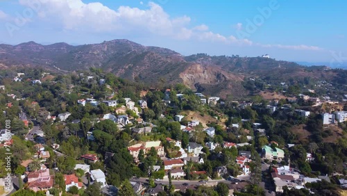 Drone shot panning left to reveal the Hollywood Sign